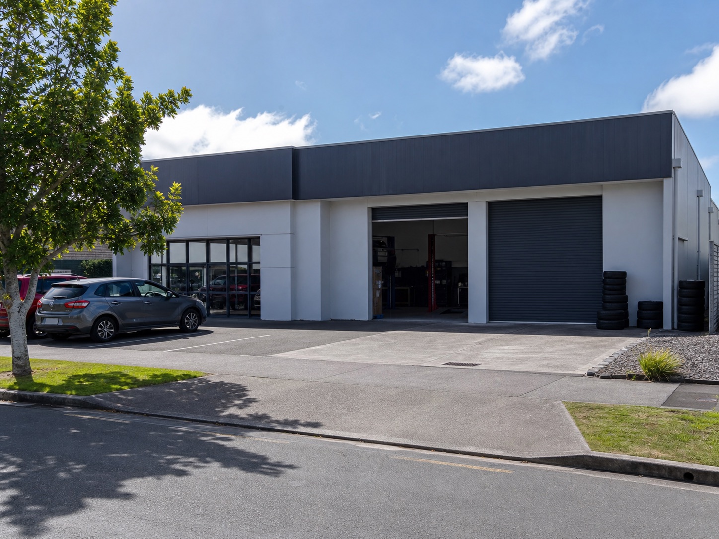 Generated placeholder of an automotive workshop frontage with customer parking