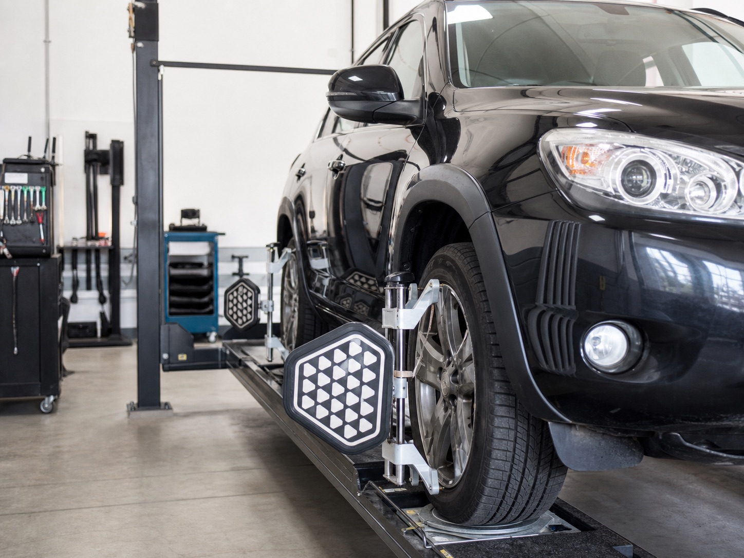 Generated placeholder of wheel alignment equipment on a vehicle in a workshop